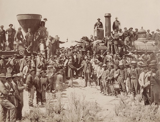 1280px-East_and_West_Shaking_hands_at_the_laying_of_last_rail_Union_Pacific_Railroad_-_Restoration.jpg