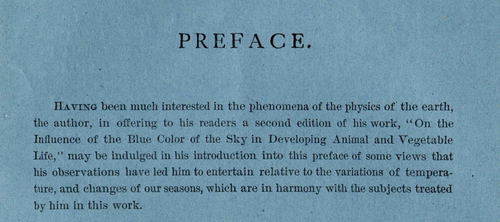 Close-up of a book preface printed on blue-tinted paper. The heading “PREFACE.” appears at the top, followed by text discussing the influence of the blue color of the sky on animal and vegetable life and its relation to natural phenomena and seasons.