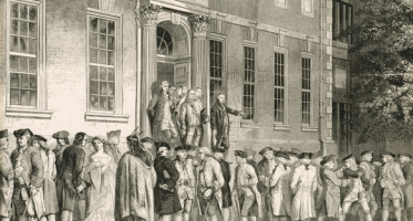 Historical engraving depicting a crowd gathered outside a colonial-era building with classical columns and architecture. Figures in 18th-century dress stand on the building's steps and entrance while others assemble in the foreground. The scene illustrates the public reading of the Declaration of Independence in colonial Philadelphia, a pivotal moment in American history.